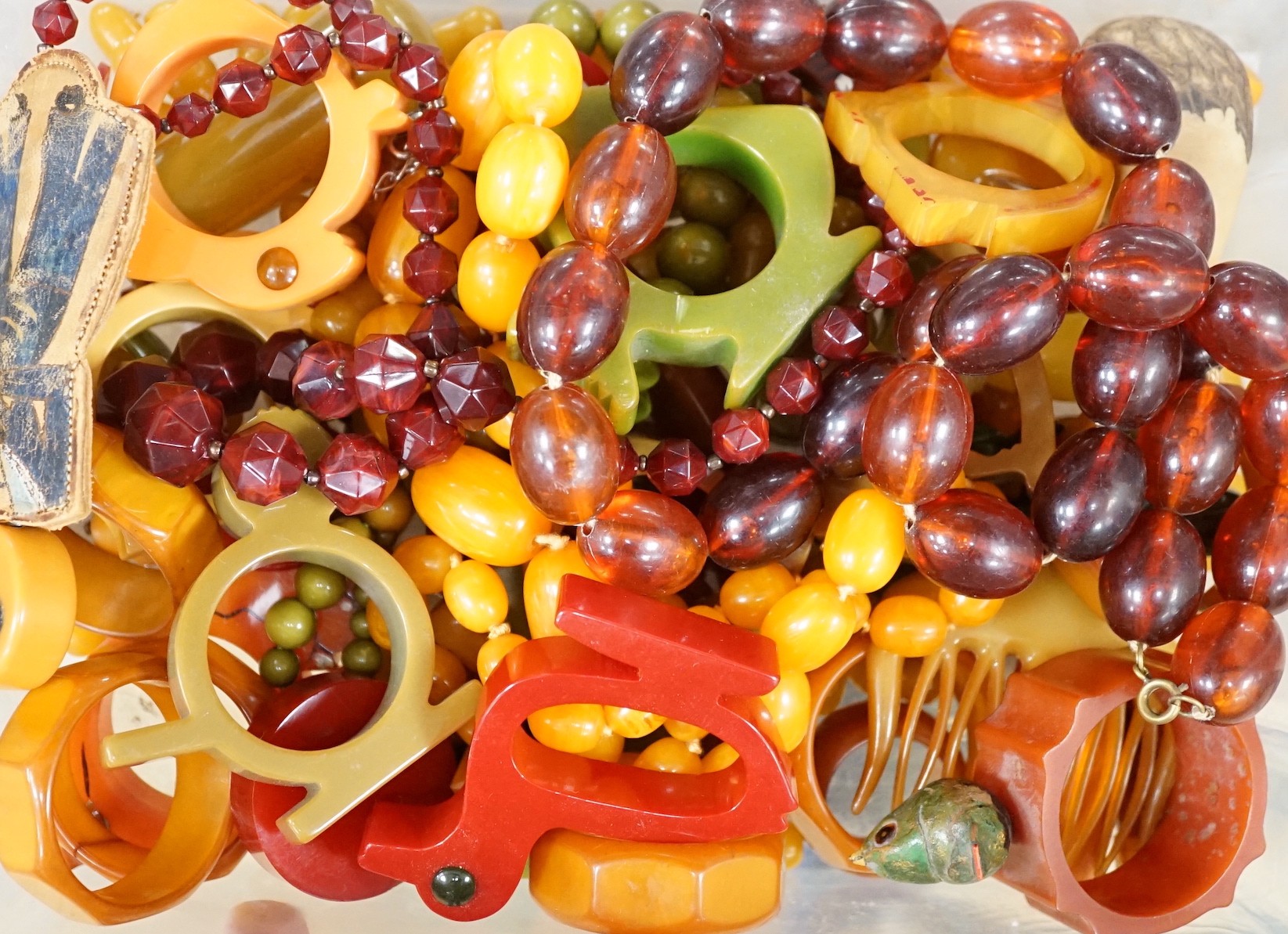 An Art Deco amber phenolic Bakelite bead necklaces etc